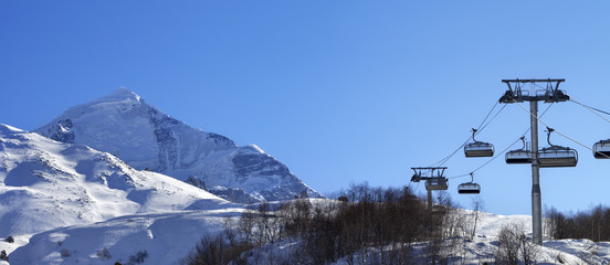 Fototapeta na wymiar Ski resort at sun winter morning