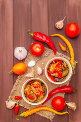 Marinated salad with pickled vegetables: eggplant, carrot, pepper, tomato, garlic