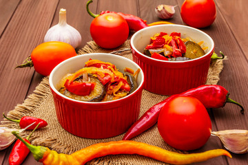 Marinated salad with pickled vegetables: eggplant, carrot, pepper, tomato, garlic