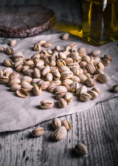 still life of isolated pistachios in the foreground in studio.