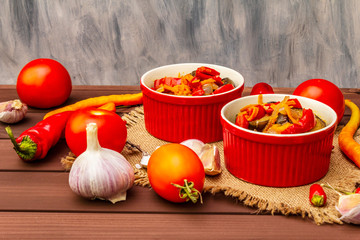 Marinated salad with pickled vegetables: eggplant, carrot, pepper, tomato, garlic