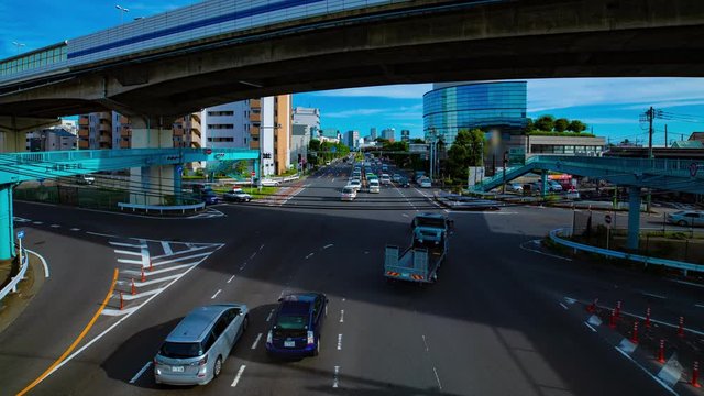 A timelapse of downtown street at Kanpachi avenue in Tokyo daytime wide shot panning