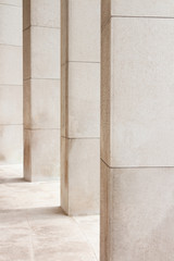 Light beige stone columns filling the frame