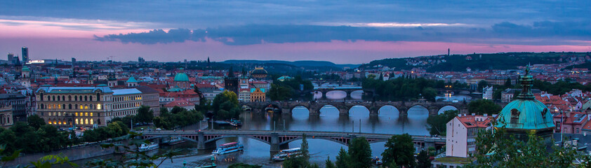 Fototapeta na wymiar Night view of bridges on the Vltava river and historical center of Prague