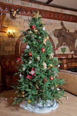 Fototapeta na wymiar Beautiful christmas tree isolated . Christmas tree in an old home . Decorated Christmas tree .