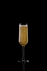 full champagne glass on black background