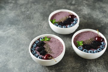 Organic chia seeds smoothie with blackberries, cherries, blueberries and yogurt. Healthy food. Smoothie bowl. Top view. 