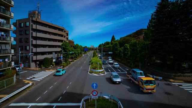 A timelapse of downtown street at Kanpachi avenue in Tokyo daytime wide shot panning