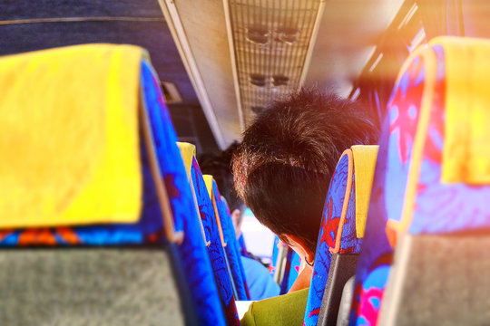 The Passengers In The Bus Which Are Tourists. Woman Sitting In Her Seat Inside Public Transport. Tired Exhausted Woman Taking A Nap In Bus. Falling Asleep During A Long Ride.