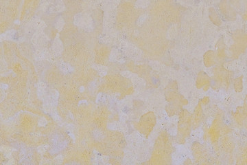 Light yellow tone stone texture. The texture of the Sandstone surface. Background of porous limestone stone of beige color.
