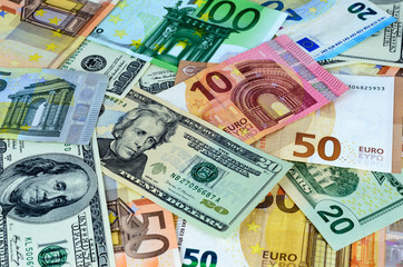 Obraz na płótnie Canvas Background with USA dollar andEuropean currency euro notes. Money texture