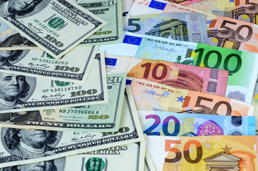 Background with USA dollar andEuropean currency euro notes. Money texture
