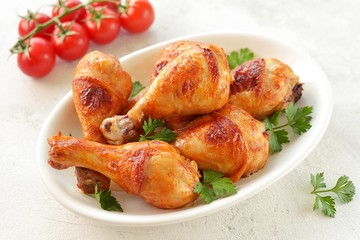 Chicken drumsticks baked in marinade with tomato sauce, soy sauce and olive oil.