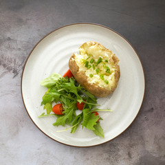 Baked Potato with Butter and Chives and a Salad