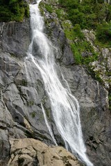 Obraz premium High Waterfall on a Mountain Range