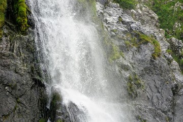 Obraz premium High Waterfall on a Mountain Range