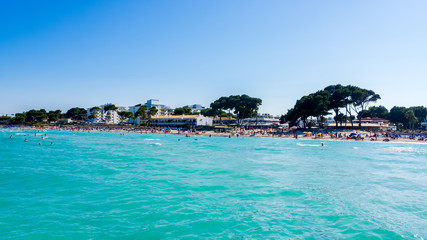 Tourists enjoying sun holidays on Alcudia beach, Mallorca