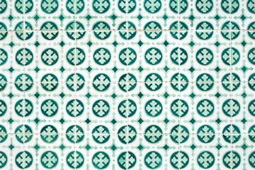 Traditional ornate portuguese decorative tiles azulejos in white and green colours.