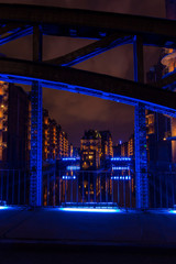 Hamburgs water castle illuminated with blue light in the dark 