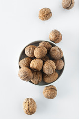 Walnut kernels, whole walnuts on white background. Healthy food for brain.