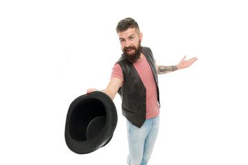Tipping his hat as a salutation. Cheerful man greeting with hat. Bearded hipster in casual attire...