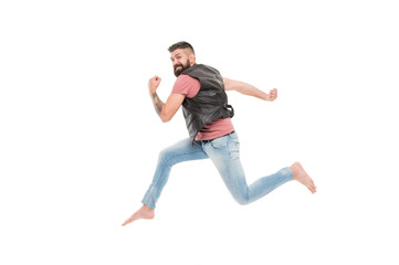 Feeling so energetic. Active and energetic hipster in photo studio. Bearded man running fast with energetic and powerful moves. Energy and energetic activity