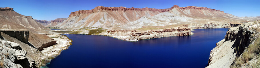Very large panorama (49MP). Band-e Amir lakes near Bamyan (Bamiyan) in Central Afghanistan. Band e Amir was the first national park in Afghanistan. The natural blue lakes are formed by travertine dams