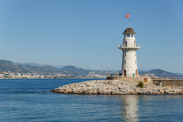 Fototapeta na wymiar The lighthouse in the port of Alanya. Turkey. Beautiful landscape view.