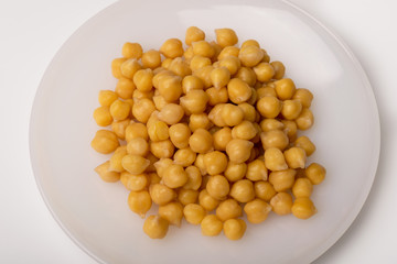 Chickpeas on a white plate closeup
