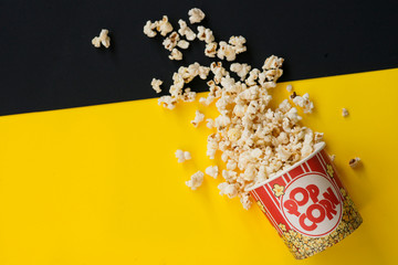 pop corn on yellow and black background