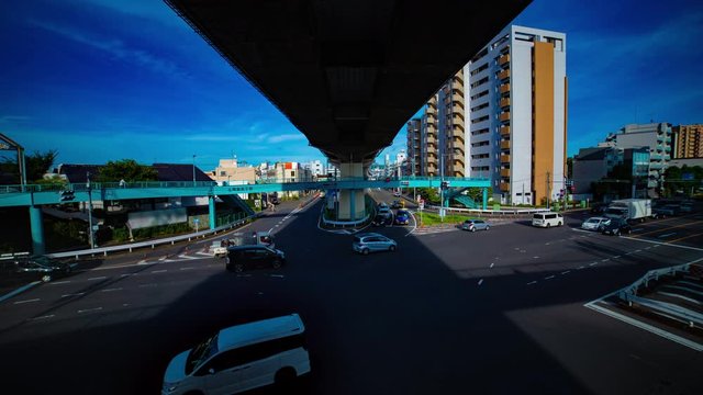 A timelapse of downtown street at Kanpachi avenue in Tokyo daytime wide shot tilt