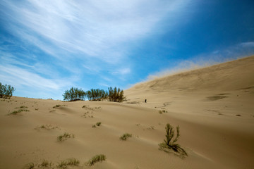 Golden sands of a singing dune in Kazakhstan
