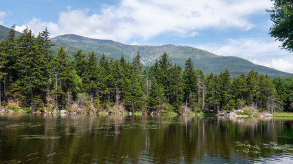Fototapeta na wymiar Lost Lake in the White Mountain National Forest. Landscape of lake with mountains in the background.