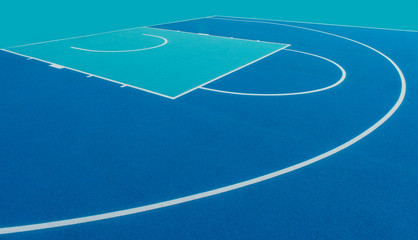 Abstract, blue background of newly made outdoor basketball court