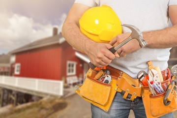 Worker with a tool belt. Isolated over  background.