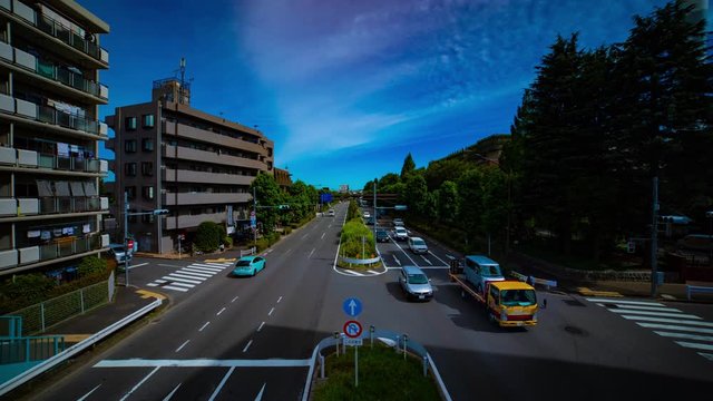 A timelapse of downtown street at Kanpachi avenue in Tokyo daytime wide shot tilt