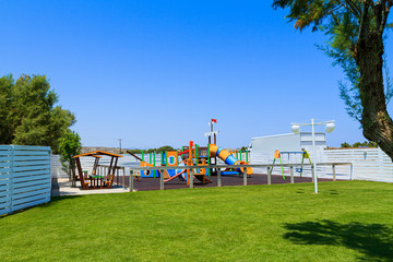 Obraz na płótnie Canvas Children's wooden playground recreation area at public park