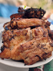 pork ribs golden brown over the grill on a table