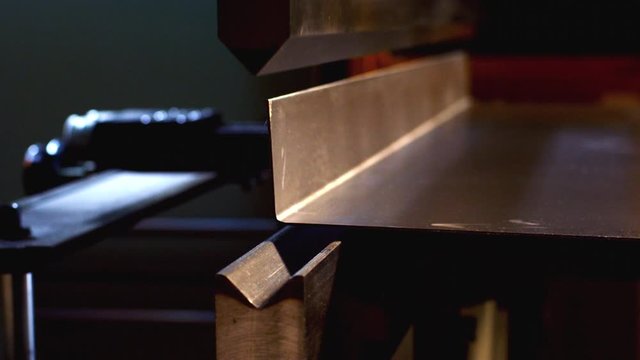Bending sheet metal with brake, slider