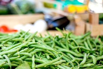 Fresh green pea pods at the morning vegetable farmer's market
