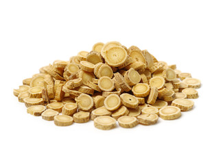 Chinese Herbal medicine - Astragalus slices, Huang Qi (Astragalus propinquus) on white background 