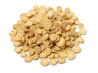Chinese Herbal medicine - Astragalus slices, Huang Qi (Astragalus propinquus) on white background 