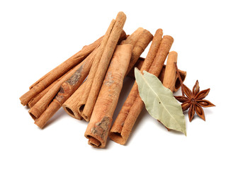 Cinnamon and anise on white background