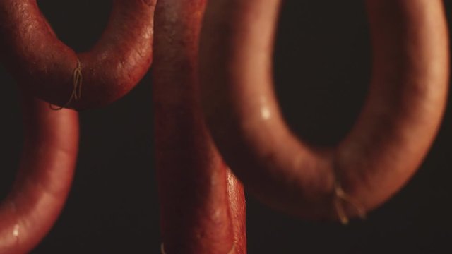 Close up, hanging and curing sausage