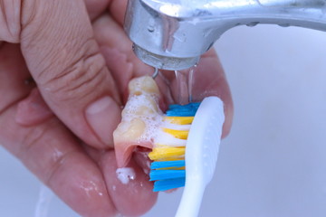 Use a toothbrush to clean teeth partial denture.