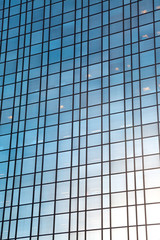 Large Modern Glass Building Reflecting Sky