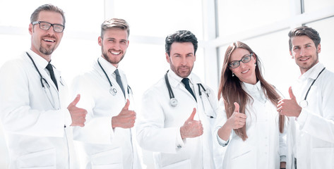 group of doctors showing thumbs up