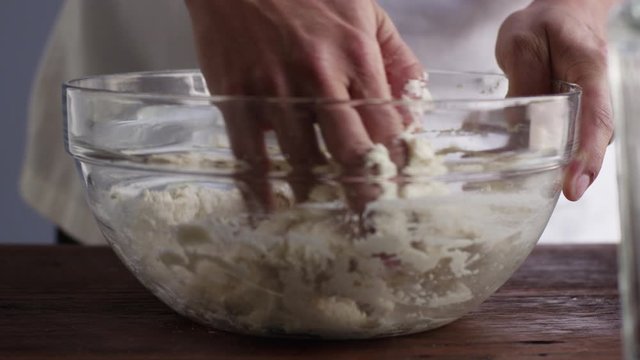 Slow motion close up, mixing ingredients in mixing bowl