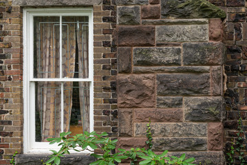 View at white window in brown blocks wall