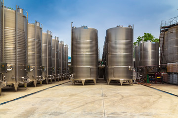 Fototapeta premium Large metal containers for fermenting and making wine